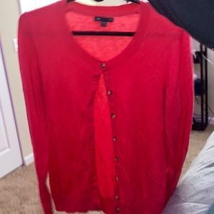 a pink knit cardigan sold by gap